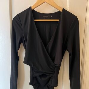 NWT. Black wrap bodysuit.